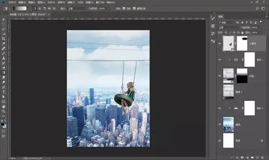场景合成，通过PS合成在城市上空荡秋千的男孩