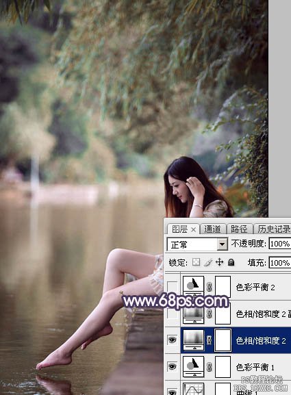 ps调出在河边洗脚的长发美女图片