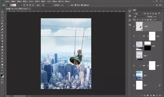 场景合成，通过PS合成在城市上空荡秋千的男孩