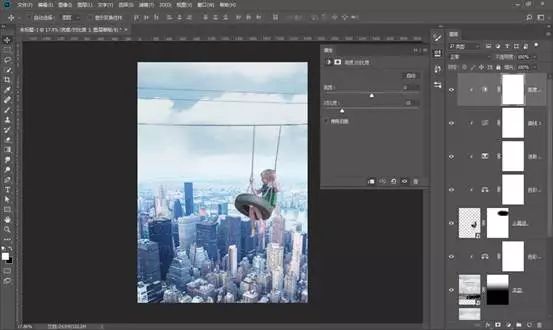場景合成，通過PS合成在城市上空蕩秋千的男孩